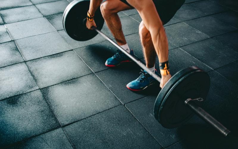 a person's legs and feet on a exercise ball