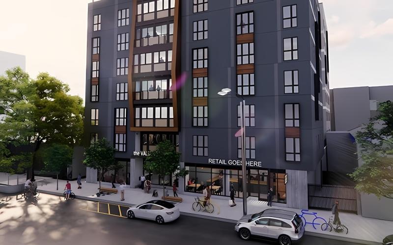 a large building with cars parked in front of it