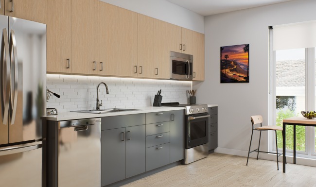 Kitchen with stainless steel appliances, light wood cabinets on top, medium  grey cabinets on bottom, and white quartz countertops. 