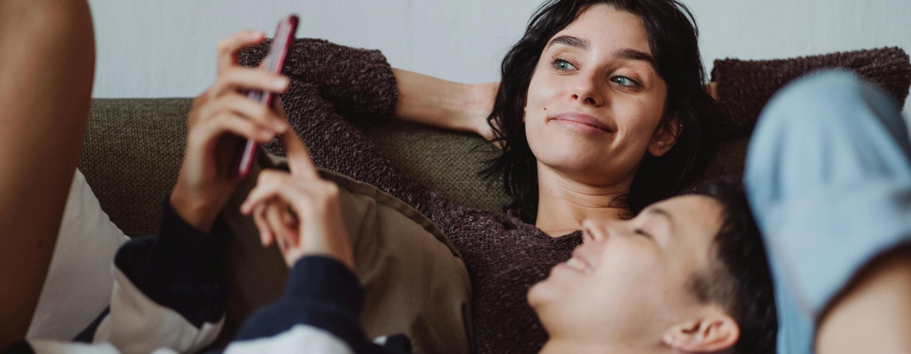 a person lying on a person's chest